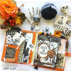 an open halloween scrapbook with lots of spooky things and decorations on it