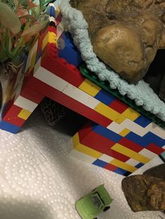 there is a toy car and some rocks on the table