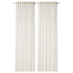 two white curtains hanging on a wall