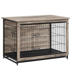 a dog crate with its door open and some wire in the bottom half, sitting on top of a wooden table