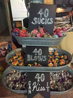 three tiered trays filled with candies for sale