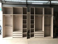 two open closets sitting inside of a garage