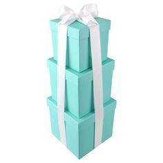 a stack of blue gift boxes with white ribbons