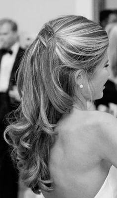 the back of a woman's head in black and white