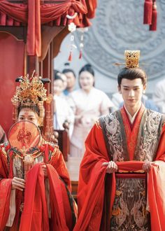 two men dressed in traditional chinese costumes