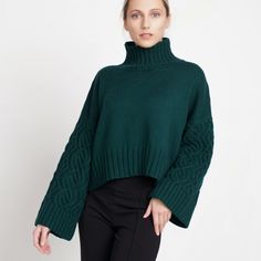 Add effortlessly chic oversized pullover YUA to your winter edit. Extra soft premium Italian merino wool, relaxed fit and stylish extra wide sleeves make this straight-up neck sweater the one you want to slip into every frosty morning. Size Regular, ready to ship! Details -Drop shoulder -       Mock neck -Long wide sleeves -Cable knit -Hand-knitted. Dark green colour. Sustainable |Biodegradable | Zero synthetics Designed and ethically made in North Europe, EU. Materials: 100% merino wool. Care: we recommend dry cleaning for the best results.  Please keep your knitted piece folded and not on a hanger. Each garment is provided with a neat cotton dust bag, ideal for careful storage. Size Regular, fits XS-M Length 45cm /17.7inch Width 50cm /19.7inch Sleeve length 50cm /19.7inch The model's hei Winter Crop Top, Aran Jumper, Frosty Morning, North Europe, Cable Knit Sweater Womens, Pull Oversize, Aran Sweater, Oversized Pullover, Pullover Sweater Women