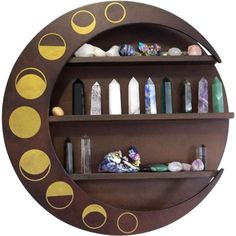 a wooden shelf filled with lots of different types of rocks and stones on top of it