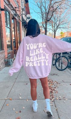 "This unique sweatshirt is made with quality fabric that is soft to the touch.. The design is simple, yet eye-catching, with a bold font that reads \"You're Like, Really Pretty.\". Perfect for any season, this sweatshirt is sure to become your favorite go-to item! Material & Care -50% cotton, 50% polyester -Medium-heavy fabric -Loose fit -Sewn-in label -Runs true to size -Wash Inside Out  -Gildan 18000 - Size Up For Oversized Fit Any questions just ask :) xo, Bobbi" Trendy Oversized Crew Neck Sweatshirt, Long Sleeve Hoodie With Text Print For Loungewear, Oversized Trendy Sweater With Graphic Print, Trendy Oversized Sweater With Graphic Print, Trendy Long Sleeve College Sweatshirt, Trendy Relaxed Fit Sweater For College, Trendy Fall Sweatshirt With Screen Print, Cotton Hoodie With Letter Print And Drop Shoulder, Trendy Fall Sweater With Screen Print