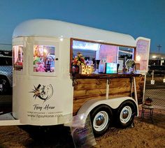 a food truck is parked on the side of the road