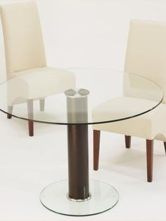 a glass table with two chairs around it