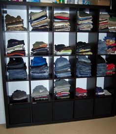 a closet filled with lots of different types of clothes