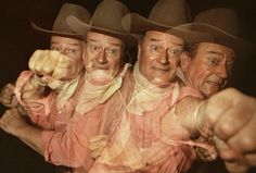 three men in cowboy hats pointing at the camera