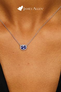 Celebrate a classic look with this necklace featuring an east-west set tanzanite oval surrounded by a halo of diamonds and a signature clasp for a perfect adjustable fit | James Allen Necklace Style: 8340727W14 | #diamondpendant #diamond #diamonds #diamondjewelry #diamondnecklace #diamondring #jewelry #diamondearrings #jewellery #pendant #diamondjewellery #finejewelry #jewellerydesign #whitegold #fashion #gemstone #jamesallen Bold Statement Jewelry, Tanzanite Pendant, Jewellery Pendant, Diamond Necklace Designs, Gold Wedding Jewelry, Chic Necklace, Necklace Chain Lengths, Beautiful Engagement Rings, Women's Jewelry And Accessories