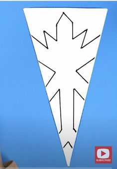 a paper cut out of a white triangle on a blue background