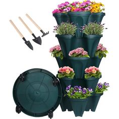 a large stack of flower pots with gardening tools next to it