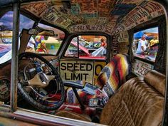 the interior of an old car is covered in graffiti