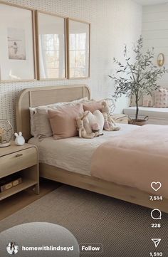 a bed room with a neatly made bed and pillows