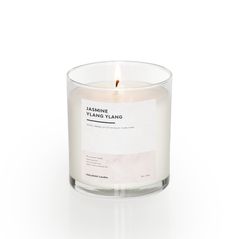 a candle that is sitting on top of a white tablecloth with the words, lemon and yland lang printed on it