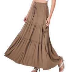 Tiered Ruffle Raw Hem Maxi Skirt - Drawstring Elastic Waist - Raw Hem 39" Long Sensual Fashion Boutique Is Filled With A Curated Collection Of Styles: Boho Bohemian Hippie Retro Vintage Coachella Festival Free People Aztec Tribal Floral Vacation Fall Winter Spring Summer Casual Cocktail Coat Sweaters And More. Our Best Sellers Are Free People Umgee Easel Pol Stella Marina Collezione Gigio Hayden And Zenana To Name A Few. We Carry An Abundance Of Styles, Trends, Patterns, Sizes, And Textures. Som Summer Brown Ruffled Maxi Skirt, Bohemian High Waist Non-stretch Maxi Skirt, Bohemian Flowy Full-length Maxi Skirt, Cheap Bohemian Non-stretch Maxi Skirt, Bohemian Non-stretch Maxi Skirt, Red Maxi Skirt, Long Flowy Skirt, Plus Size Boho, Flowy Maxi Skirts