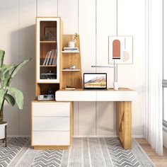 a white desk with a laptop computer on top of it next to a potted plant