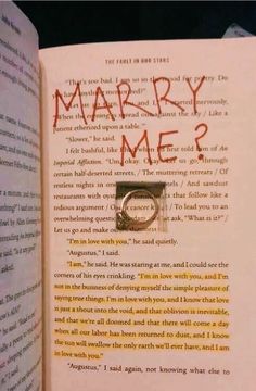 an open book with the words marry me? written on it