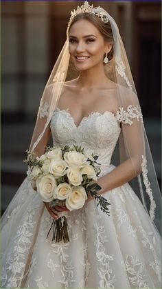 a woman in a wedding dress holding a bouquet