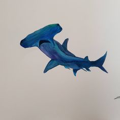 a painting of two blue sharks in the air