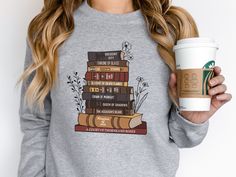 Vintage Books Series Sweatshirt, Bookish gift for SJM fan, Reading Books apparel, Book Lover, Bookworm Librarian Gift, Reading teacher gift **Please take note of the listing that you are selecting, as I have a few versions of this design in my shop! Makes the perfect pairing with our matching jumbo canvas tote: https://www.etsy.com/cozyfunlifestyle/listing/1337111126 This vintage-style SJM Book Series Sweatshirt is a great gift for teachers, librarians and book lovers. Great for a book worm shir Book Apparel, Bookish Clothes, Bookish Outfits, Book Sweatshirts, Bookish Sweatshirts, Reading Teacher Gifts, Bookworm Shirt, 100 Books, Books Series