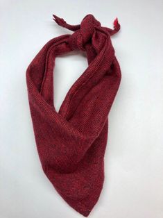 a red and black scarf on a white background