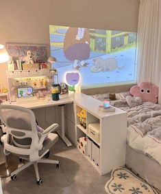 a child's bedroom with a bed, desk and chair in front of a cartoon screen