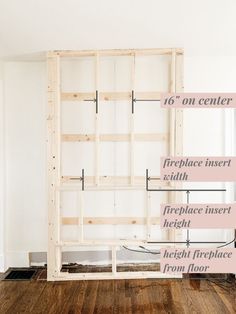 an unfinished room with wood flooring and measurements for the wall to be built into