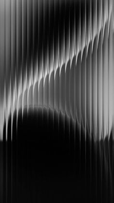 an abstract black and white photo with wavy lines