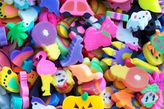 there are many different types of toys in the pile together, including plastic magnets