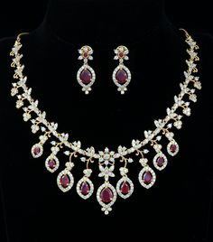 This exquisite Mothers Day Gift necklace showcases a charming South Indian-style gold floral design, featuring ruby and emerald stones. Intricately handcrafted, this statement jewelry will add a beautiful touch to wedding or special occasion outfit. Occasion Outfit, Indian Wedding Jewelry, Ruby Necklace, Ruby Emerald, Special Occasion Outfits, Kundan Necklaces, Cz Jewelry, Floral Necklace, Emerald Stone