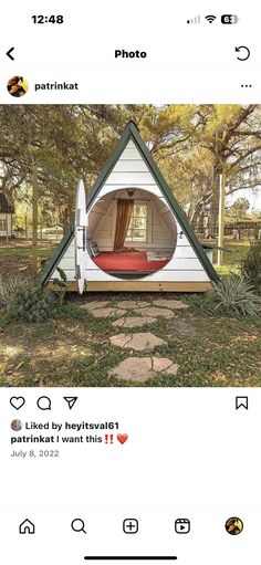 an instagramted photo of a tent in the grass with a bed inside it