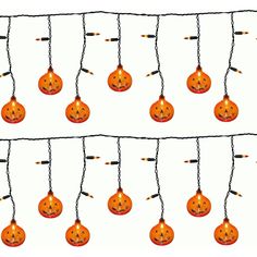 an image of halloween pumpkins hanging from strings with lights on the top and bottom