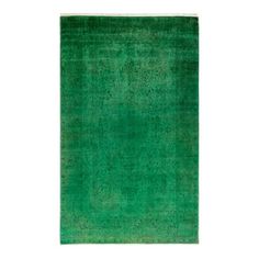 a green rug on a white background with no one in the room to see it