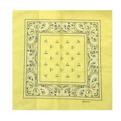 a yellow bandanna with an ornate design on the front and bottom, in black ink