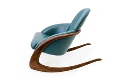 a blue chair sitting on top of a wooden frame with an armrest and foot rest