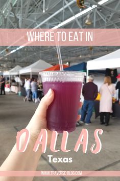 a person holding up a drink with the words where to eat in dallas texas