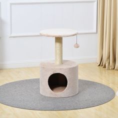 a cat tree in the middle of a room