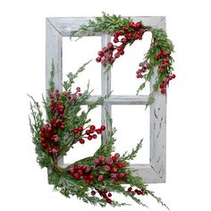 a window decorated with red berries and greenery for the holiday season is shown in front of a white background