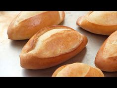 several loaves of bread sitting on top of a table