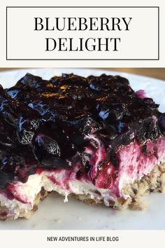 a close up of a plate of food with blueberry delight on it and the words new adventures in life blog