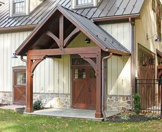 a house with a metal roof and wooden doors