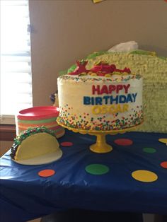 a birthday cake sitting on top of a blue table