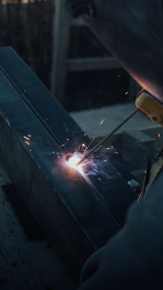 welder working on an object with sparks