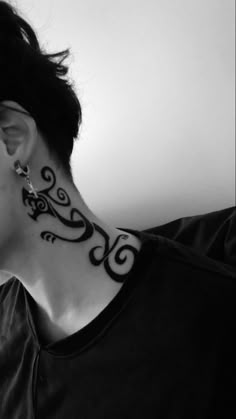 a woman with a tattoo on her neck