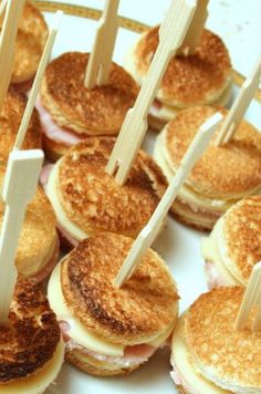 mini sandwiches with toothpicks stuck in them