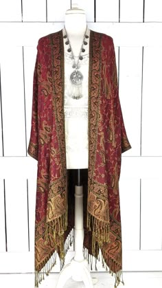 "Handmade burgundy paisley pashmina kimono cover up jacket with custom regular and maxi lengths and optional fringe detail Measurements...taken flat - width across seam to seam: 46\" - regular length with fringe: 38\" - regular length without fringe: 34\" - Maxi length is as selected with or without fringe Features... - lovely soft woven medium weigh pashmina fabric - bohemian oversized flowing design - cardigan style with an open front and generous arm holes - universal design allows a comforta Bohemian Fall Kimono With Tassels, Bohemian Tassel Kimono For Fall, Fitted Red Bohemian Kimono, Elegant Long Sleeve Kaftan With Tassels, Fitted Bohemian Wrap Kimono, Traditional Fall Wrap Kimono, Traditional Wrap Kimono For Fall, Fall Bohemian Fringe Kimono, Bohemian Fringe Kimono For Fall